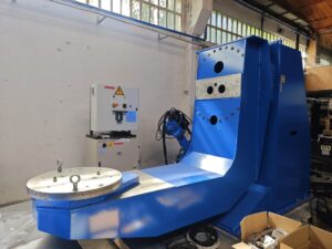Yaskawa Motoman HP20D welding robot with MT1-3000 S2D positioner and control cabinet — front view