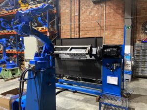 Overhead view of complete welding cell configuration with robot and positioner